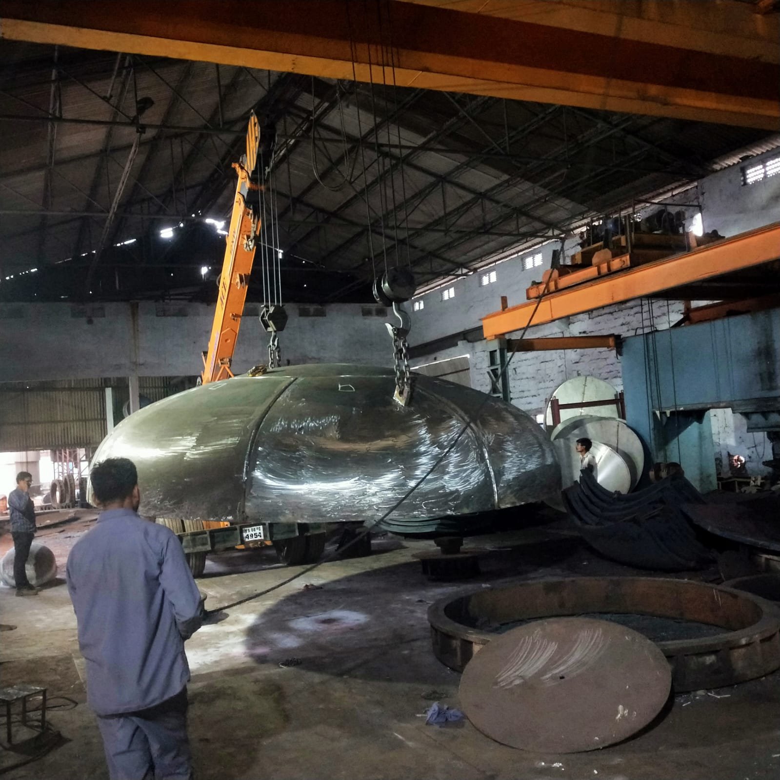 Large dished end being moved by crane facilities